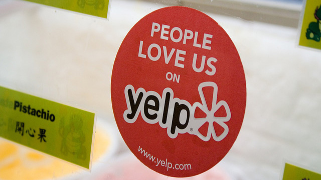 Yelp Sticker and Reviews (adapted) (Image by StickerGiant Custom Stickers [CC BY 2.0] via Flickr)