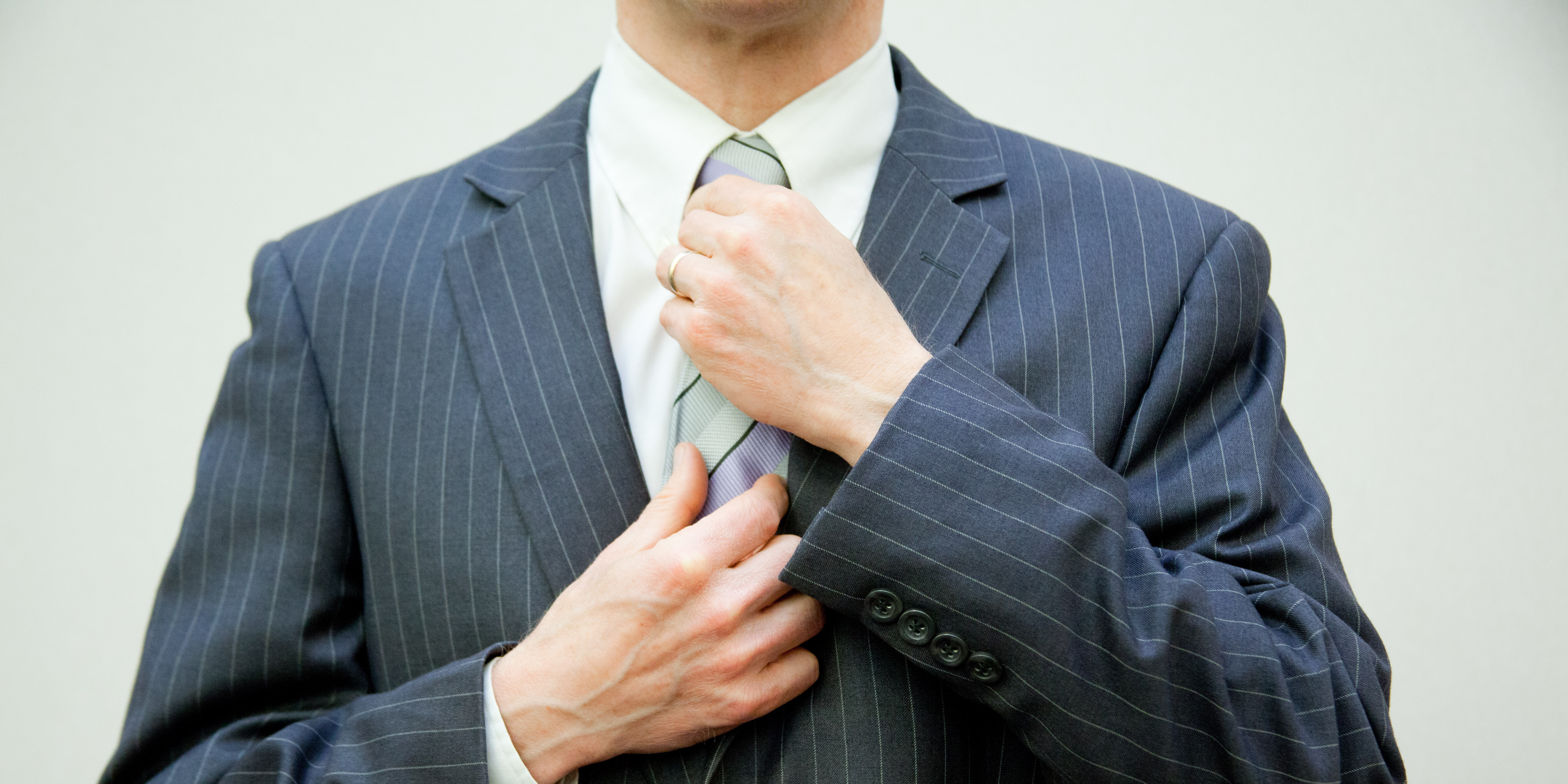 Individual in a Suit (adapted) (Image by Flazingo Photos [CC BY-SA 2.0] via Flickr)