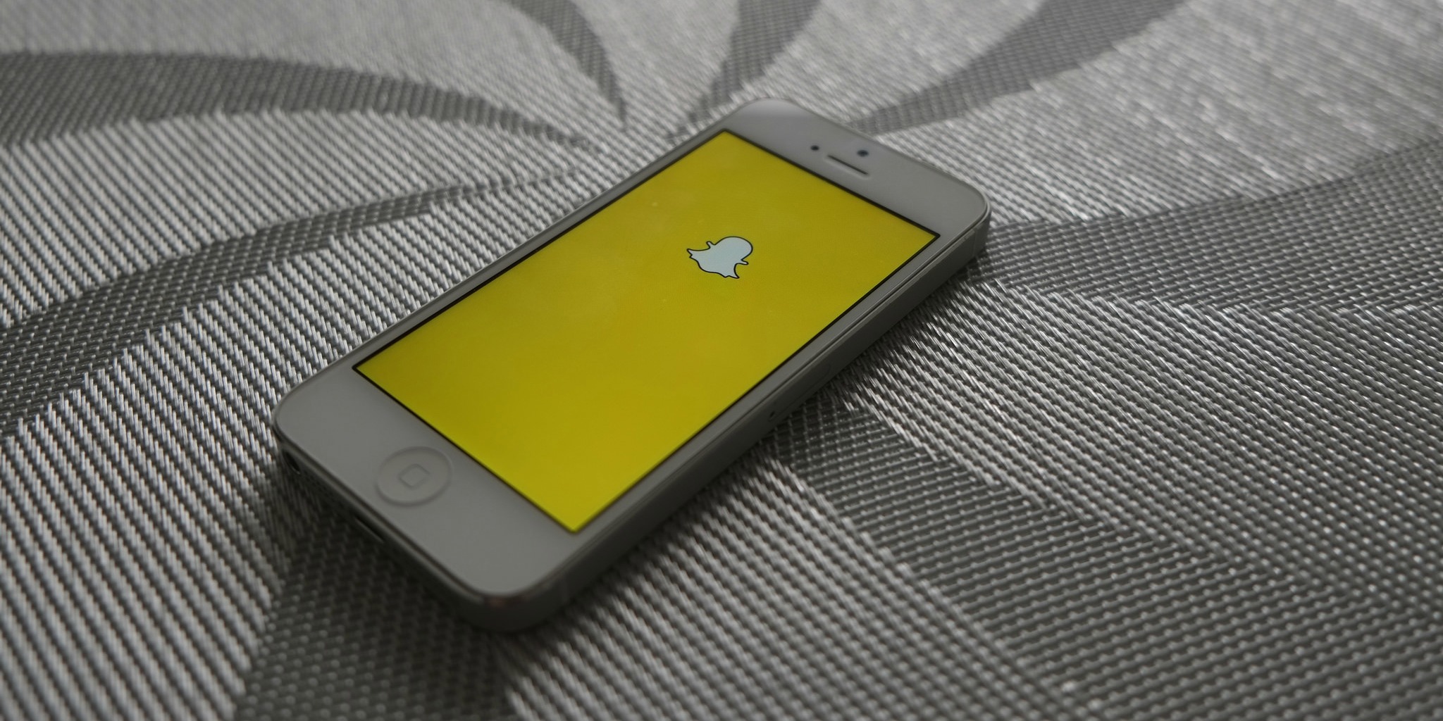 Snapchat (adapted) (Image by AdamPrzezdziek [CC BY-SA 2.0] via flickr)