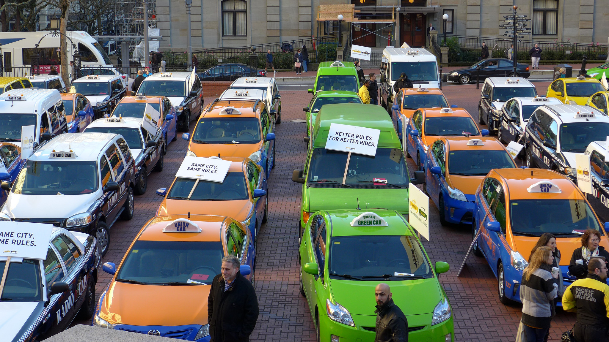 Taxi Cabs vs Uber (adapted) (Image by Aaron Parecki [CC BY 20] via Flickr)
