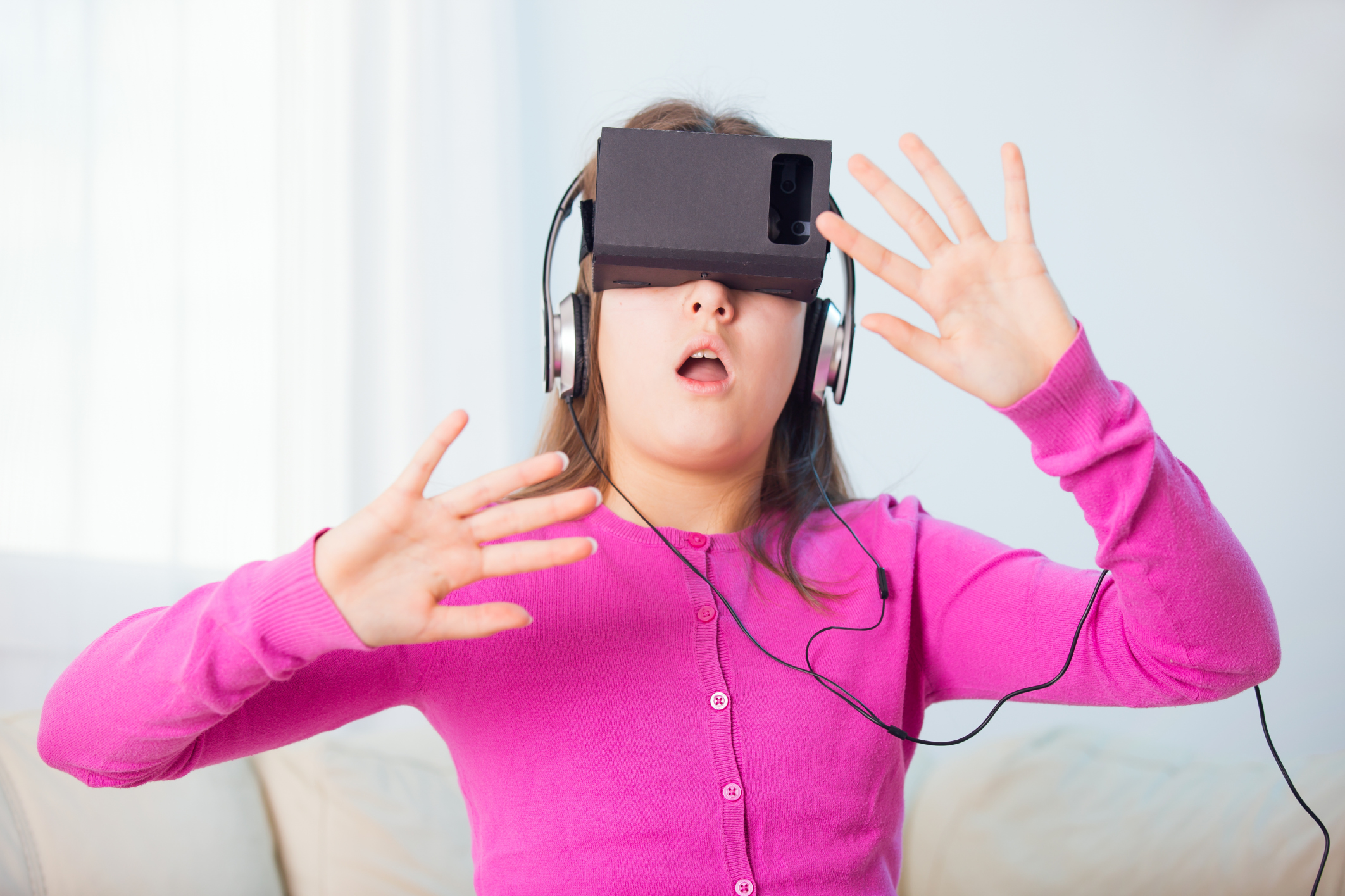 Girl Playing Video Game With Virtual Reality Headset